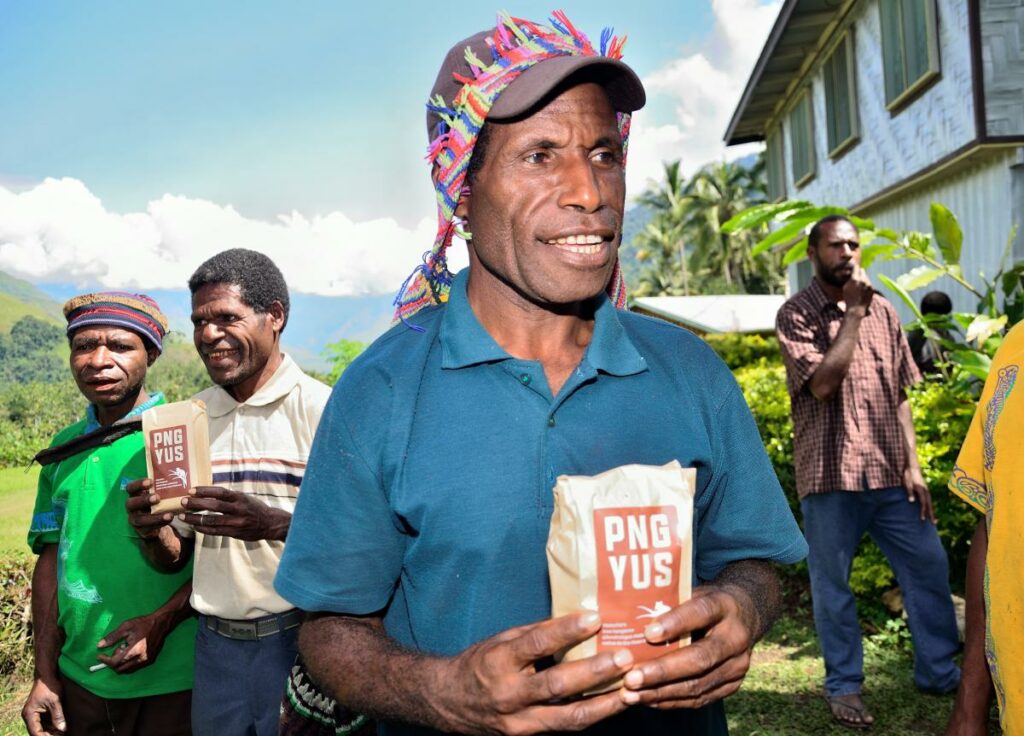 Community tasting their first batch of Tree-Kangaroo friendly coffee